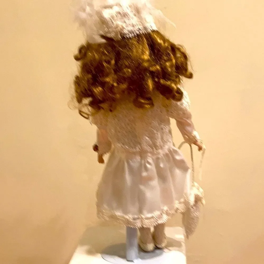 Porcelain doll with satan and lace trim dress with umbrella 15 inches
